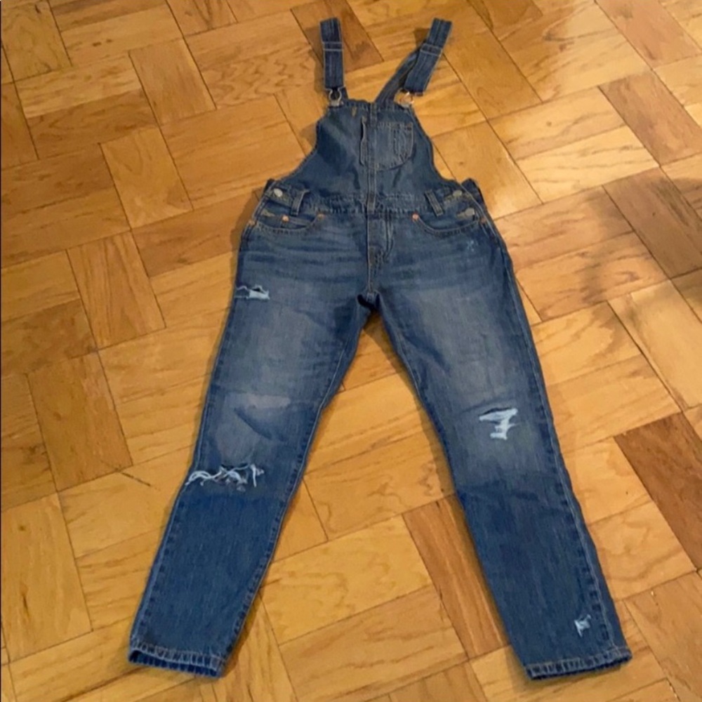 Lightly distressed Levi overalls medium wash